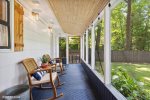 Lovely back porch overlooks large, fenced-in backyard